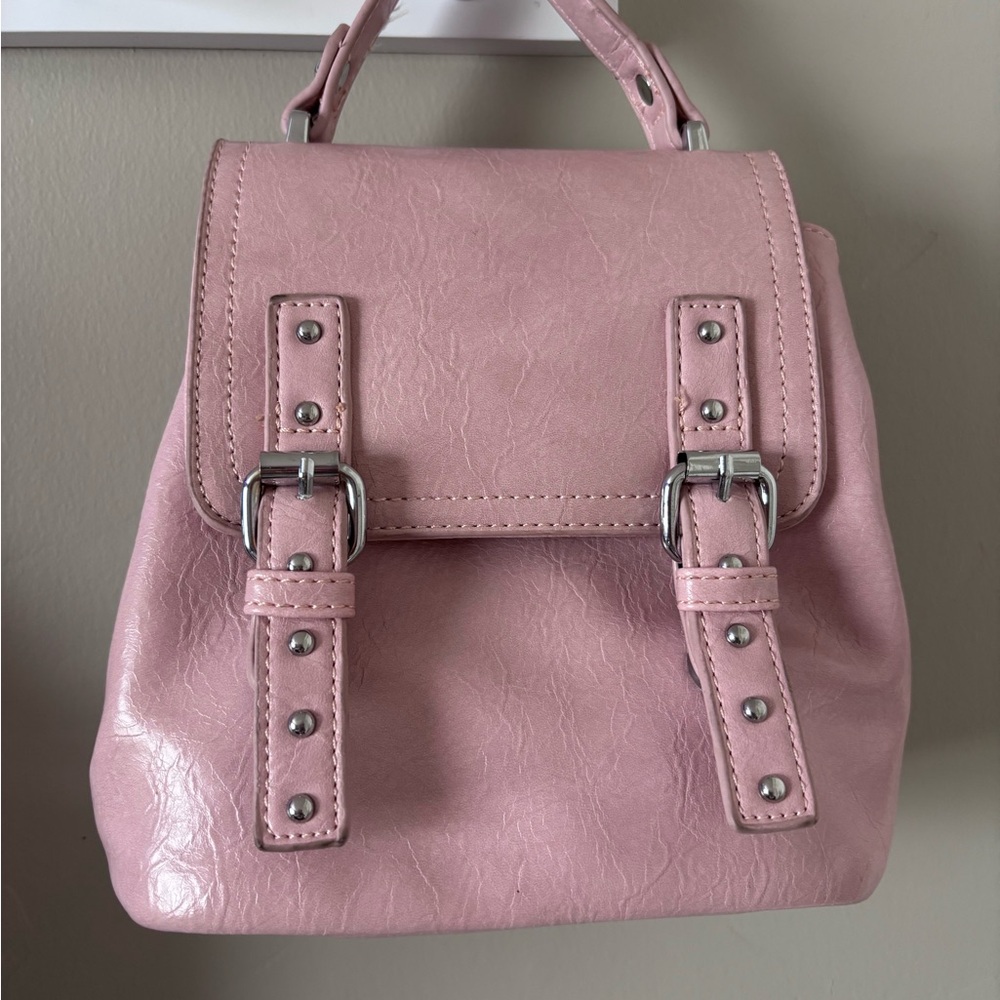 Pink Backpack with Glossy Finish and Buckle Straps